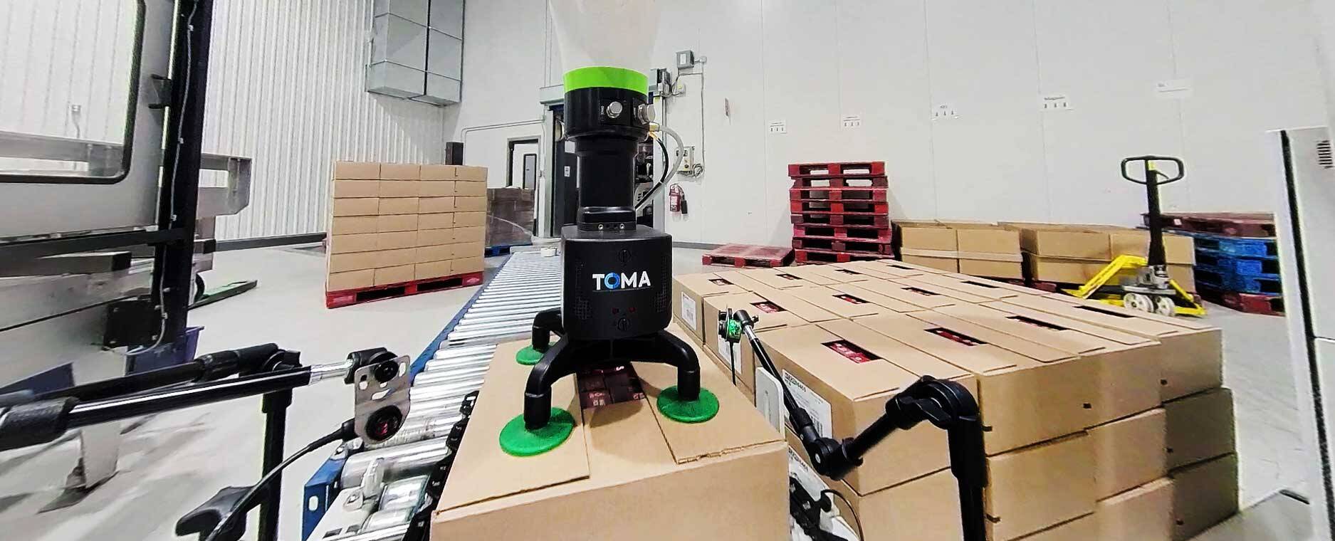 TOMA palletizer placing a box on a pallet